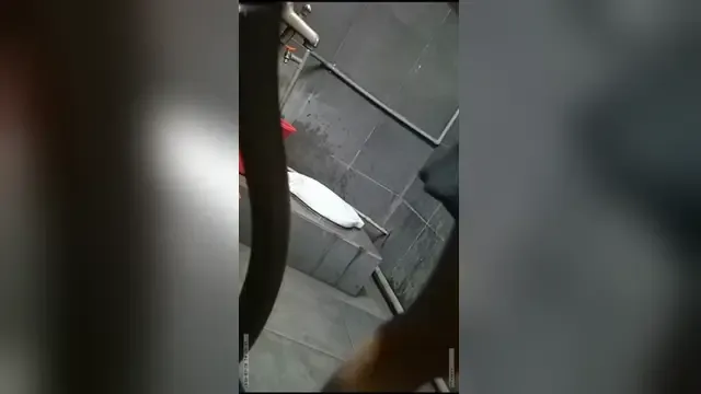 Close-up of secretly filming beautiful girls in public restrooms