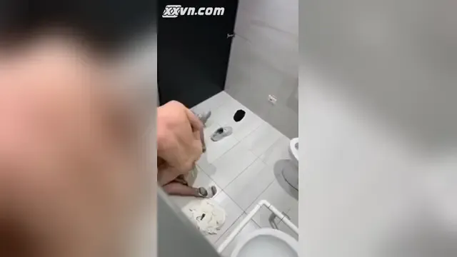 Sneaking a video of a couple having sex in the bar restroom